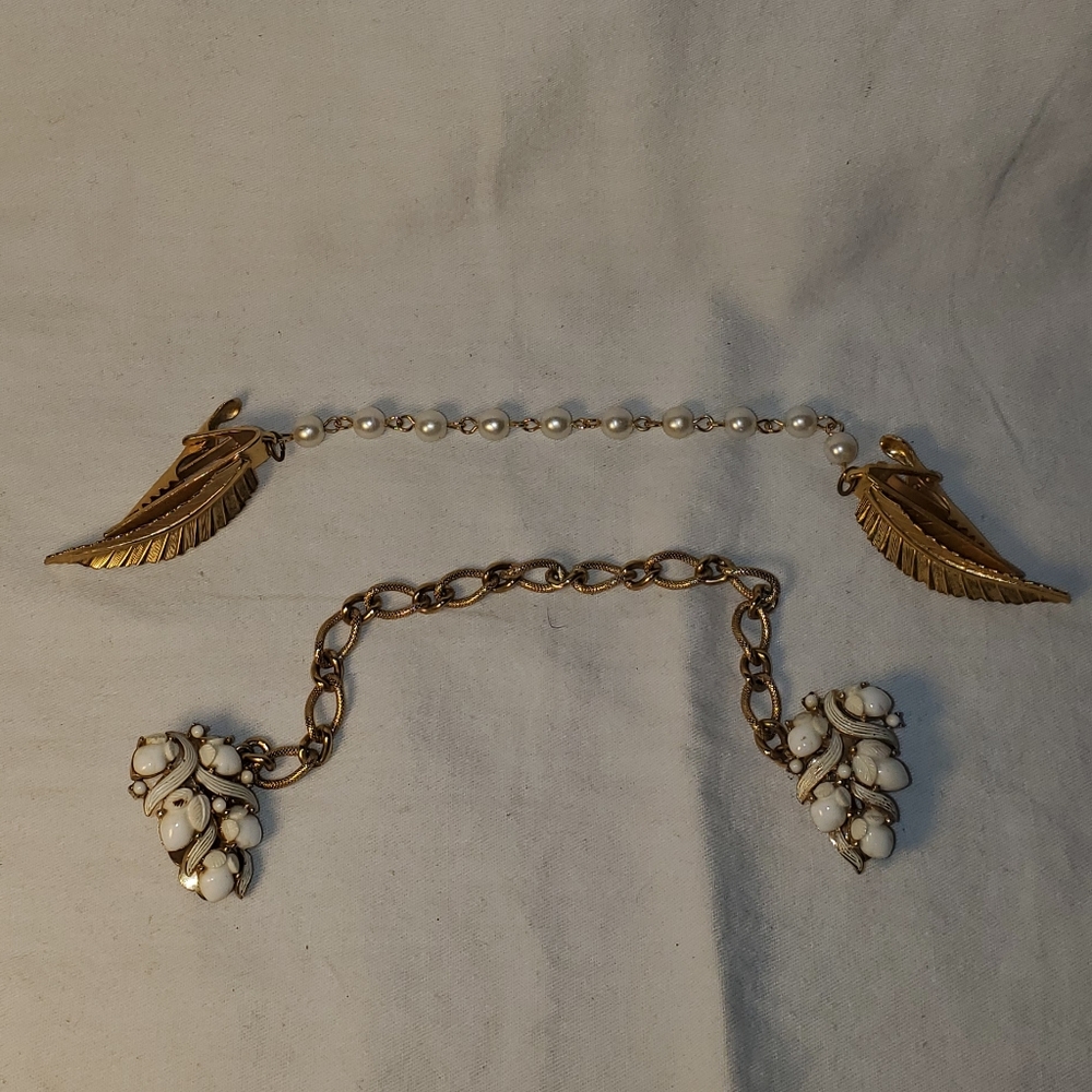 2 vintage sweater clips. One is crown Trifari.